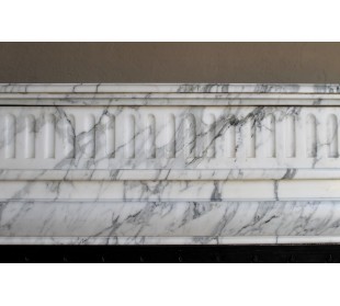 Antique “Boudin” fireplace mantel carved in veined white Calacatta marble. This mantel has its original cast iron insert. 2