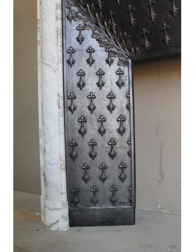 Antique “Boudin” fireplace mantel carved in veined white Calacatta marble. This mantel has its original cast iron insert.