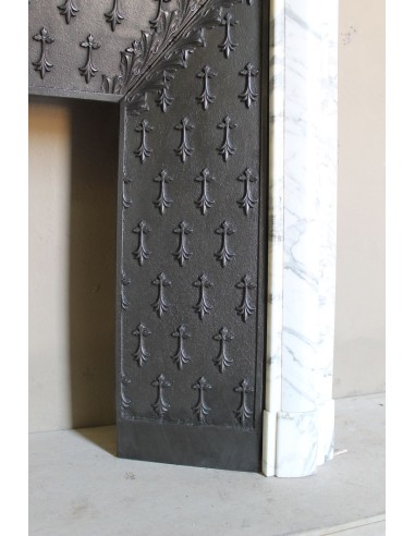 Antique “Boudin” fireplace mantel carved in veined white Calacatta marble. This mantel has its original cast iron insert.