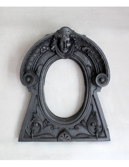 Cast iron Oeil de boeuf “Tête de Femme” mantelpiece. This mantel is genuine, authentic, signed by Majorelle.