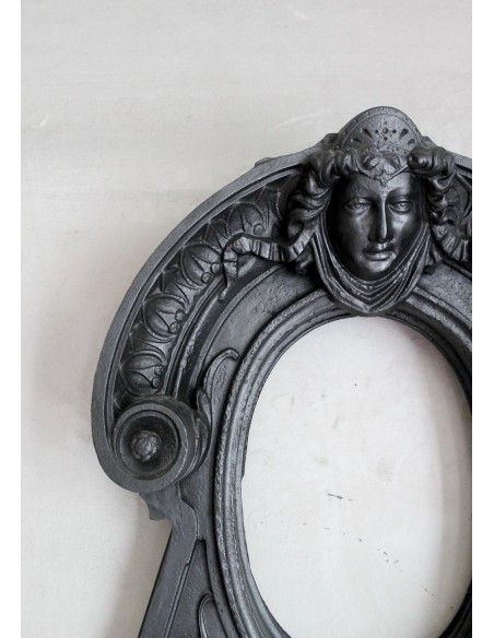 Cast iron Oeil de boeuf “Tête de Femme” mantelpiece. This mantel is genuine, authentic, signed by Majorelle.