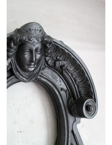 Cast iron Oeil de boeuf “Tête de Femme” mantelpiece. This mantel is genuine, authentic, signed by Majorelle.