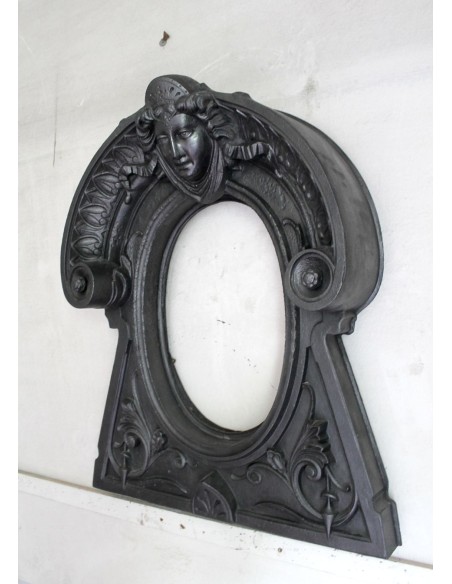 Cast iron Oeil de boeuf “Tête de Femme” mantelpiece. This mantel is genuine, authentic, signed by Majorelle.