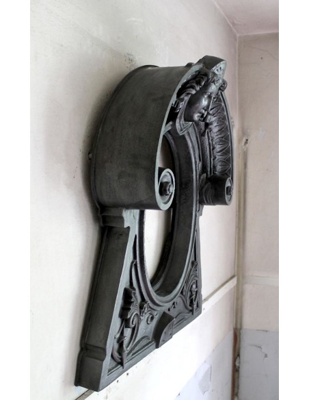 Cast iron Oeil de boeuf “Tête de Femme” mantelpiece. This mantel is genuine, authentic, signed by Majorelle.