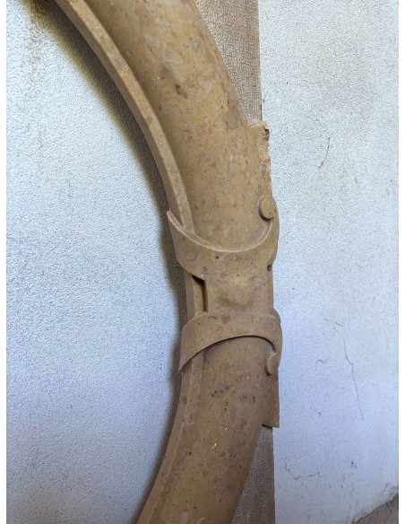 Antique Art Deco style fireplace mantel, carved in taupe marble. This suspended oeil de boeuf mantelpiece is totally original.