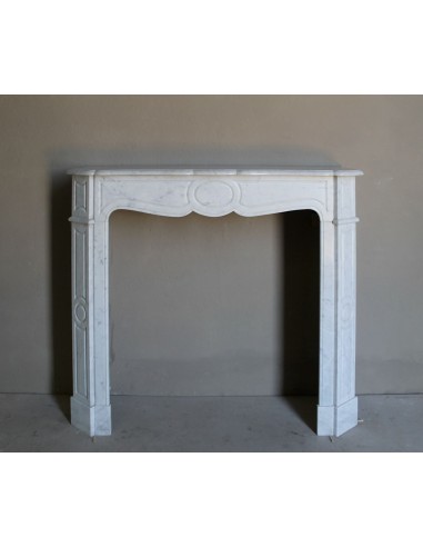 Beautiful mantelpiece carved in white Carrara marble. This fireplace mantel is antique and genuine, Louis XV style.