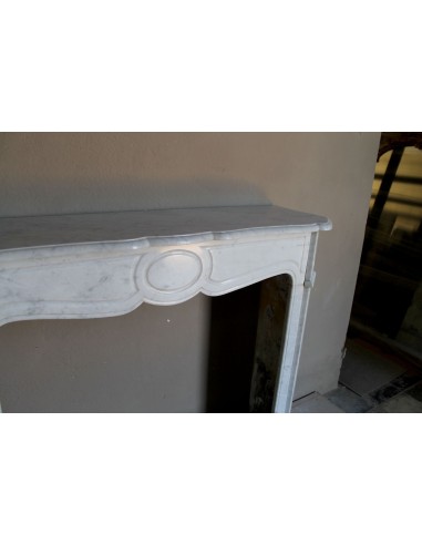 Beautiful mantelpiece carved in white Carrara marble. This fireplace mantel is antique and genuine, Louis XV style.