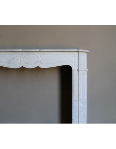 Beautiful mantelpiece carved in white Carrara marble. This fireplace mantel is antique and genuine, Louis XV style.