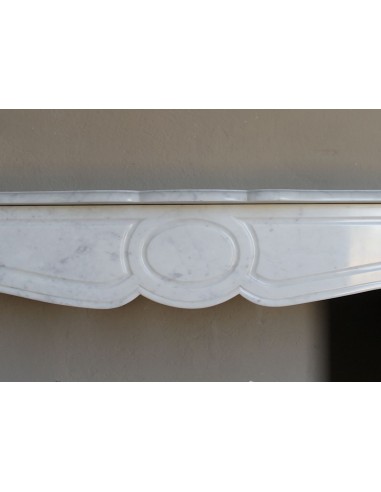 Beautiful mantelpiece carved in white Carrara marble. This fireplace mantel is antique and genuine, Louis XV style.