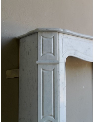 Beautiful mantelpiece carved in white Carrara marble. This fireplace mantel is antique and genuine, Louis XV style.