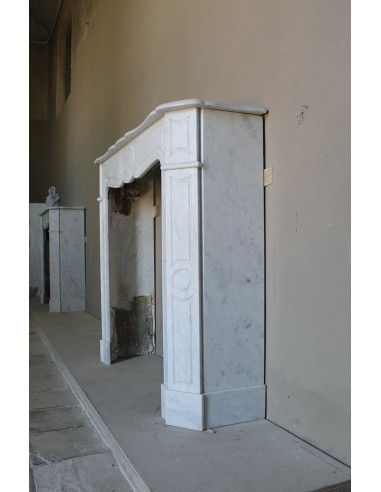 Beautiful mantelpiece carved in white Carrara marble. This fireplace mantel is antique and genuine, Louis XV style.