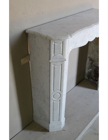 Beautiful mantelpiece carved in white Carrara marble. This fireplace mantel is antique and genuine, Louis XV style.