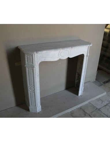 Beautiful mantelpiece carved in white Carrara marble. This fireplace mantel is antique and genuine, Louis XV style.