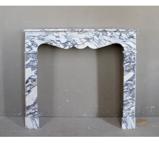 Antique Louis XV “Pompadour Plat” fireplace in Breccia Medicea marble, with veining from white to blue, purple to gold.