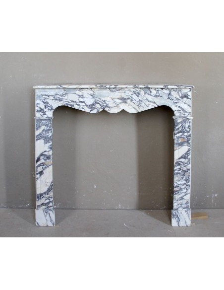 Antique Louis XV “Pompadour Plat” fireplace in Breccia Medicea marble, with veining from white to blue, purple to gold.