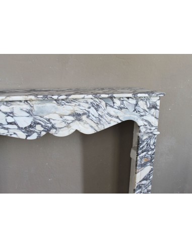 Antique Louis XV “Pompadour Plat” fireplace in Breccia Medicea marble, with veining from white to blue, purple to gold.