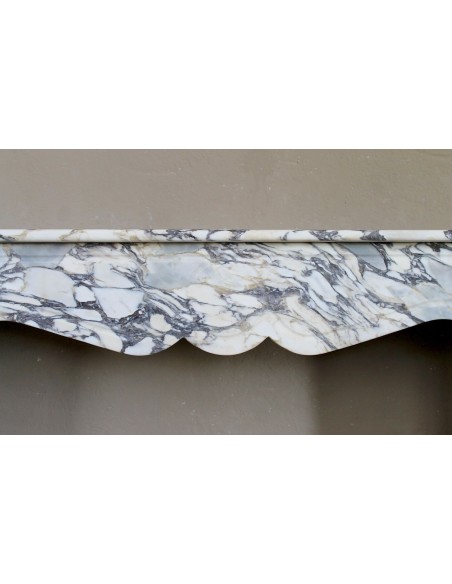 Antique Louis XV “Pompadour Plat” fireplace in Breccia Medicea marble, with veining from white to blue, purple to gold.