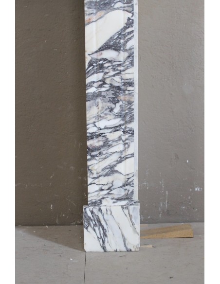 Antique Louis XV “Pompadour Plat” fireplace in Breccia Medicea marble, with veining from white to blue, purple to gold.