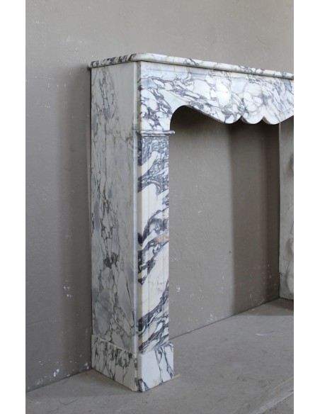 Antique Louis XV “Pompadour Plat” fireplace in Breccia Medicea marble, with veining from white to blue, purple to gold.