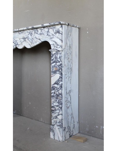 Antique Louis XV “Pompadour Plat” fireplace in Breccia Medicea marble, with veining from white to blue, purple to gold.