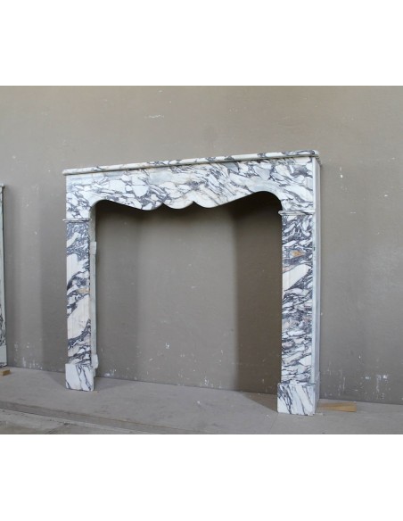 Antique Louis XV “Pompadour Plat” fireplace in Breccia Medicea marble, with veining from white to blue, purple to gold.