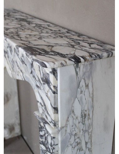 Antique Louis XV “Pompadour Plat” fireplace in Breccia Medicea marble, with veining from white to blue, purple to gold.