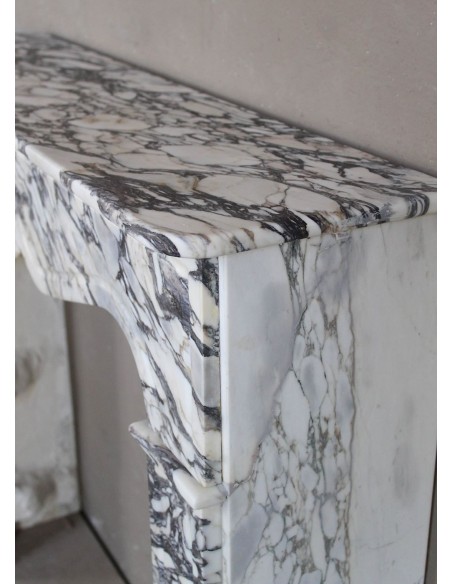 Antique Louis XV “Pompadour Plat” fireplace in Breccia Medicea marble, with veining from white to blue, purple to gold.