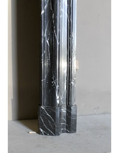 Antique “Bolection" mantelpiece in black marble with white veins. This is an elegant, contemporary and minimalist mantel.