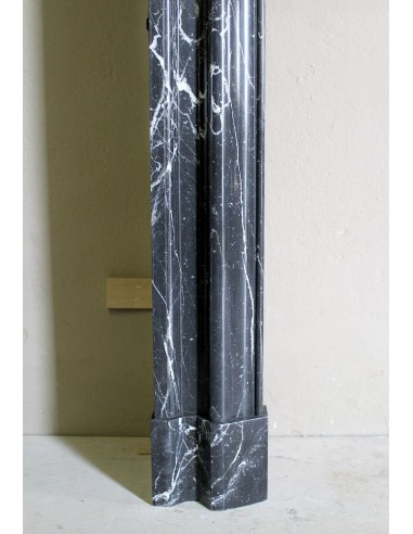 Antique “Bolection" mantelpiece in black marble with white veins. This is an elegant, contemporary and minimalist mantel.