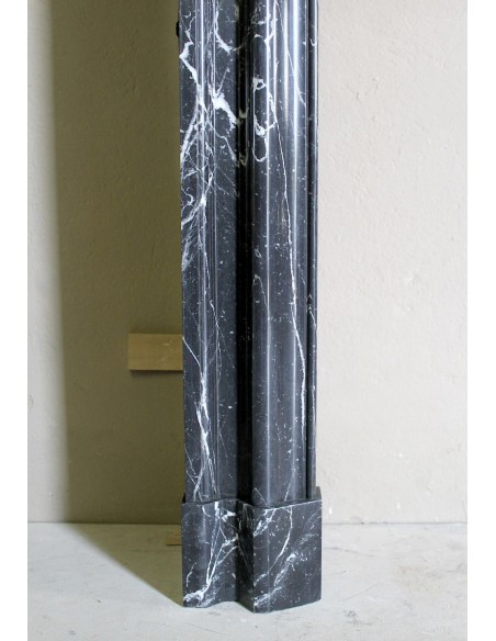 Antique “Bolection" mantelpiece in black marble with white veins. This is an elegant, contemporary and minimalist mantel.