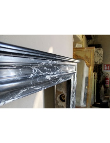 Antique “Bolection" mantelpiece in black marble with white veins. This is an elegant, contemporary and minimalist mantel.