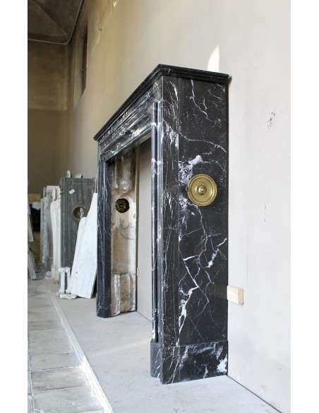 Antique “Bolection" mantelpiece in black marble with white veins. This is an elegant, contemporary and minimalist mantel.