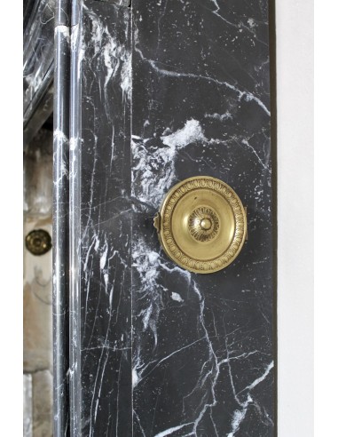 Antique “Bolection" mantelpiece in black marble with white veins. This is an elegant, contemporary and minimalist mantel.