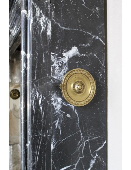 Antique “Bolection" mantelpiece in black marble with white veins. This is an elegant, contemporary and minimalist mantel.