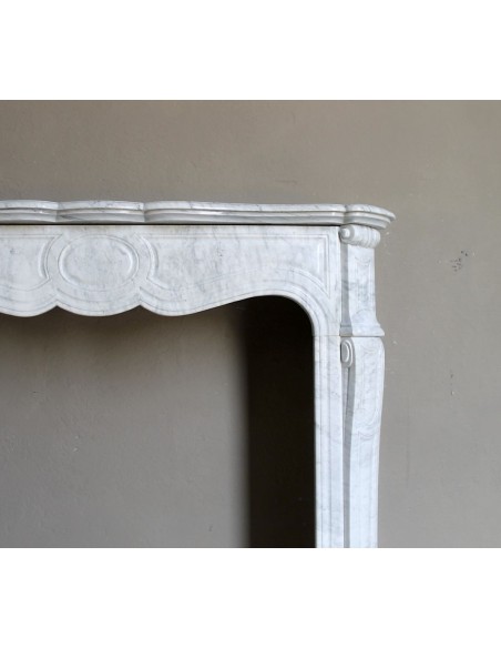 Antique Louis XV Pompadour "Pied Galbé" fireplace mantel in white marble offered at a low discounted price.