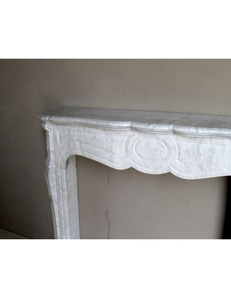 Antique Louis XV Pompadour "Pied Galbé" fireplace mantel in white marble offered at a low discounted price.