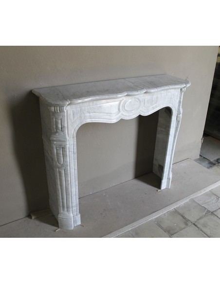 Antique Louis XV Pompadour "Pied Galbé" fireplace mantel in white marble offered at a low discounted price.