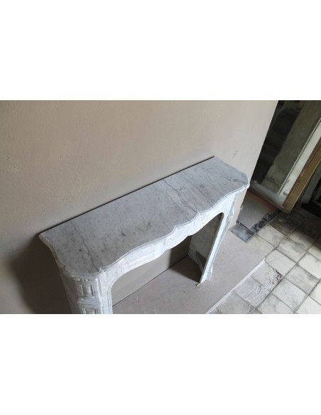 Antique Louis XV Pompadour "Pied Galbé" fireplace mantel in white marble offered at a low discounted price.
