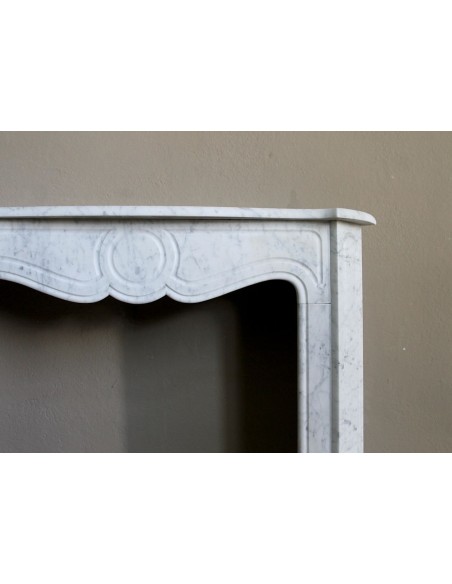 Antique Louis XV style fireplace mantel in white Carrara marble, “Pompadour” family, with its original marble floor.