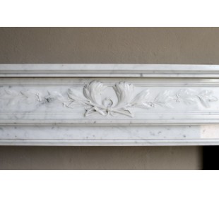 Louis XVI “Olive Branch” fireplace mantel with floral carvings in white marble, mid 20th century, offered at a discounted price. 2