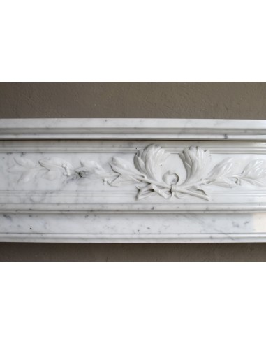 Louis XVI “Olive Branch” fireplace mantel with floral carvings in white marble, mid 20th century, offered at a discounted price.