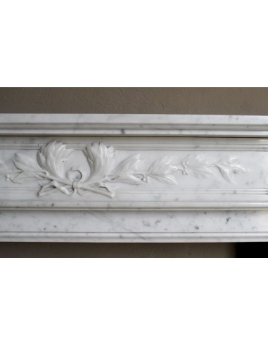 Louis XVI “Olive Branch” fireplace mantel with floral carvings in white marble, mid 20th century, offered at a discounted price.