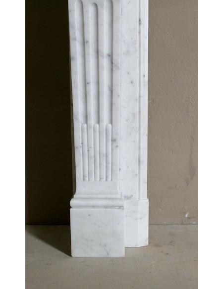Louis XVI “Olive Branch” fireplace mantel with floral carvings in white marble, mid 20th century, offered at a discounted price.