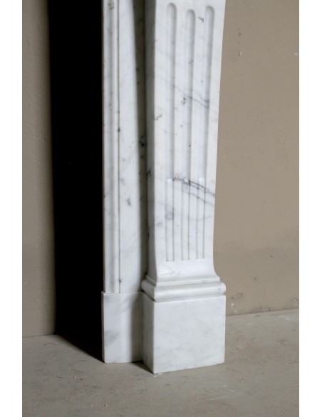 Louis XVI “Olive Branch” fireplace mantel with floral carvings in white marble, mid 20th century, offered at a discounted price.