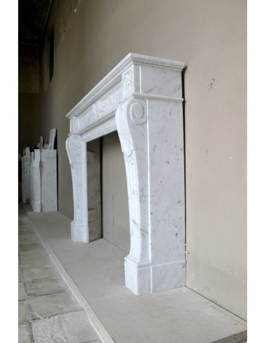 Louis XVI “Olive Branch” fireplace mantel with floral carvings in white marble, mid 20th century, offered at a discounted price.