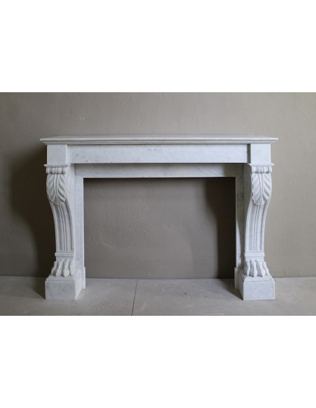 Antique marble mantel carved in white marble, with lion's paw details. This fireplace is original, authentic, a unique piece.