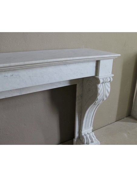 Antique marble mantel carved in white marble, with lion's paw details. This fireplace is original, authentic, a unique piece.