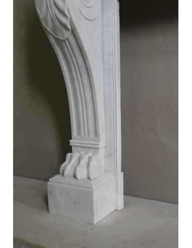 Antique marble mantel carved in white marble, with lion's paw details. This fireplace is original, authentic, a unique piece.