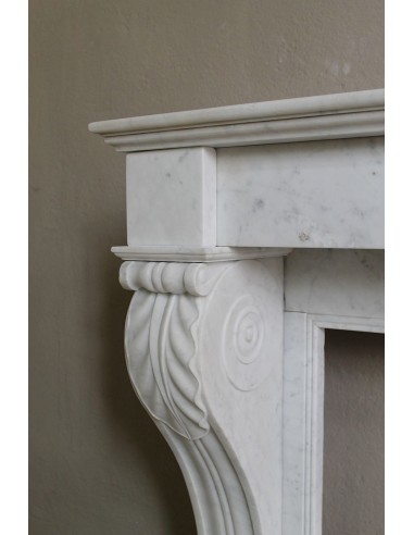 Antique marble mantel carved in white marble, with lion's paw details. This fireplace is original, authentic, a unique piece.
