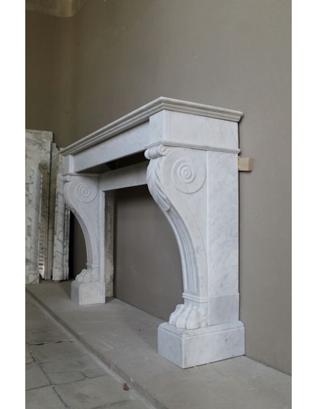 Antique marble mantel carved in white marble, with lion's paw details. This fireplace is original, authentic, a unique piece.